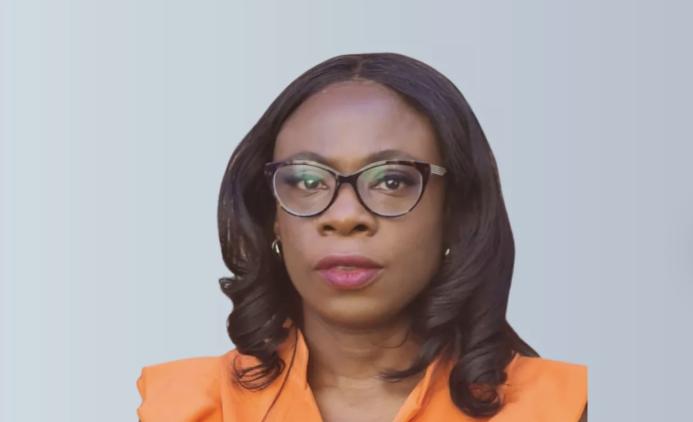 A head and shoulders picture of Ola Obadara FCIOB will serve as CIOB Vice President for 2025/26, the first black woman to hold the role, wearing an orange top and glasses with shoulder length hair