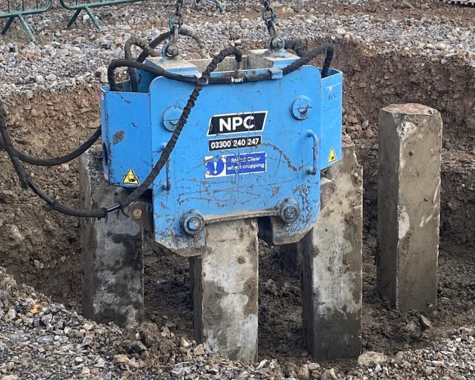 Close-up of National Pile Croppers equipment in use on site, cutting pre-cast concrete piles for the Bridgwater gigafactory foundations.
