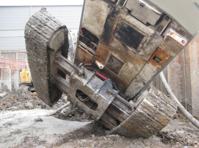 The underside of a toppled, tracked piling rig