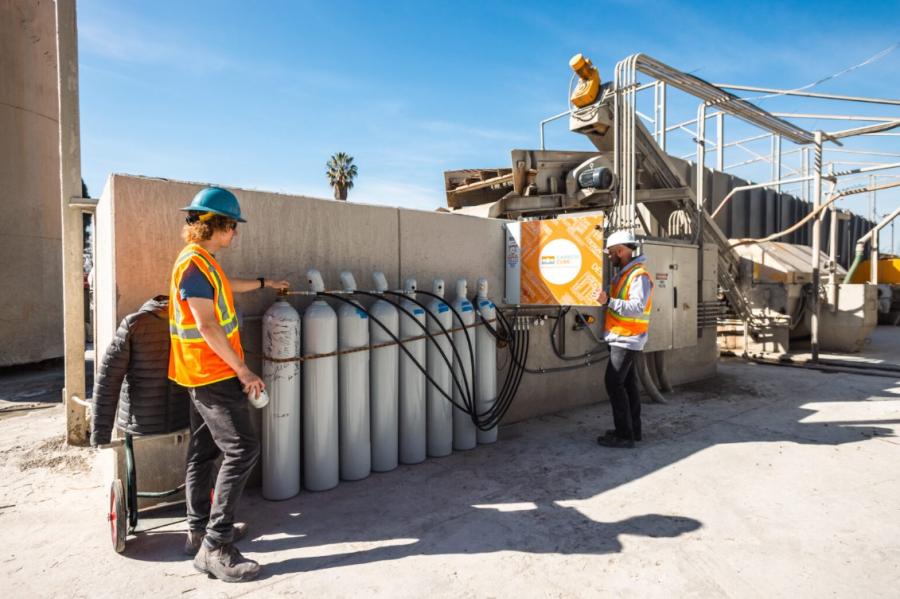 Two men working at CarbonCure's cDAC facility, US