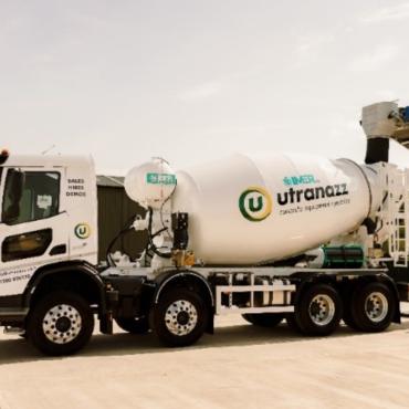 IMER's Superlight 9m³ Concrete Mixer at it's UK launch at Utranazz's Open Day on 13 and 14 June 2025, in white with a the Utranazz's logo on its side