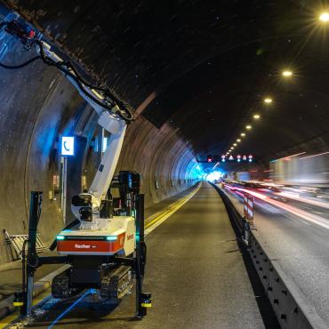 A Baubot robot drilling anchor holes to prepare for reinforced concrete linings in the Engelberg Tunnel, Germany.