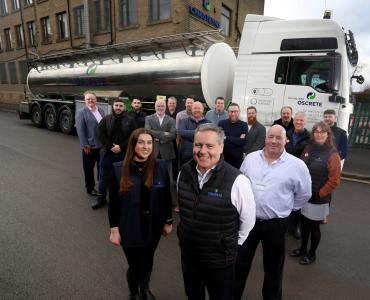 Oscrete Director Scott Wilson (front centre) is joined by the sales, lab and customer services teams at the company’s Bradford HQ to mark 40 years in business