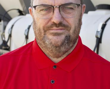 A head and shoulders photo of Steve Cartwright, General Manager, Volumech (Cemen Tech UK), in a red top, glasses, beard and greyish hair