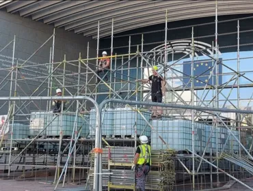 Men in PPE on a scaffolding system