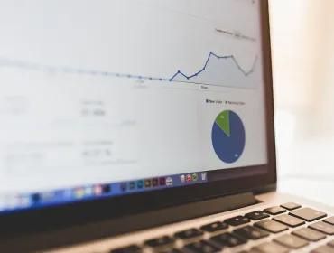 Analytics graphs on a MacBook screen by Luis Llerena / Creative Commons