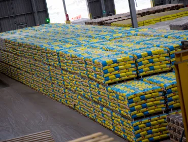 A pile of cement bags in a warehouse
