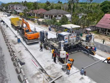 An aerial view of a road building project in Thailand showing Wirtgen’s SP 64 slipform paver installing reinforced concrete highways without the need for fixed formwork.