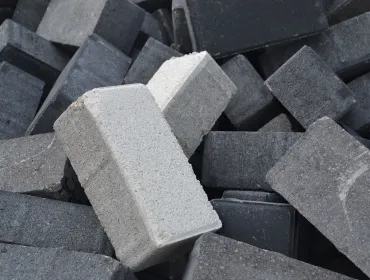 a pile of differently coloured concrete blocks.