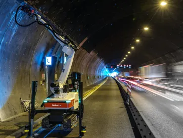 A Baubot robot drilling anchor holes to prepare for reinforced concrete linings in the Engelberg Tunnel, Germany.