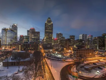 The Montréal towards sunset with a ligh dusting of snow covering the ground