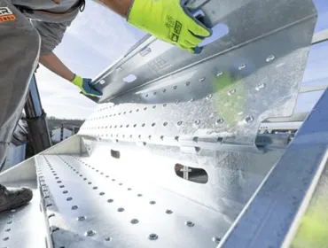 A close up of someone assembling PER UP's new "public stairs", which enable safe, high-footfall access across construction and infrastructure sites.