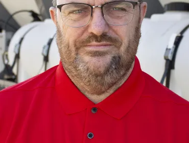 A head and shoulders photo of Steve Cartwright, General Manager, Volumech (Cemen Tech UK), in a red top, glasses, beard and greyish hair