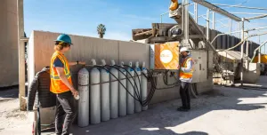 Two men working at CarbonCure's cDAC facility, US