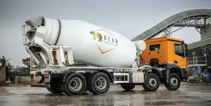 A concrete mixer in a concrete production yard in the rain