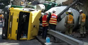 A concrete mixer truck on its side