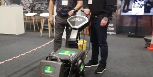 Two men standing in front of a floor stripper