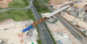 Aerial photo of a blue and brown viaduct under construction