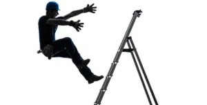 A studio created photo of a man in silhouette falling of a ladder