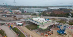 An aerial photo of an HS2 construction site showing a large concrete structure and a blue crane