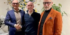 Left to right: Marco Scuratti, IMER Group; Will Harris, Utranazz; Michele Sebastiani, IMER Group shake hands on the new distribution deal between the two companies.
