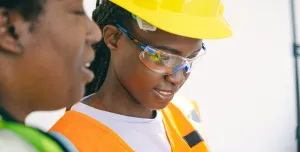 Two women in PPE.