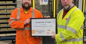 David Wykes, General Manager of KVM UK (left), presents a certificate to Christopher Appleton 
