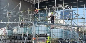 Men in PPE on a scaffolding system