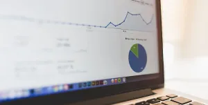 Analytics graphs on a MacBook screen by Luis Llerena / Creative Commons