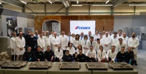 A group of people in white lab coats outside Cemex's GRD.