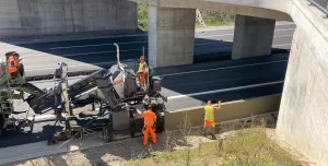 Wirtgen's SP 33 slipform paver, unveiled at World of Concrete 2025 (21-23 Jan), Las Vegas, US, before getting its European debut at this year's bauma (7-13 Apr) in Munich, Germany, working under a concrete bridge on a motorway.