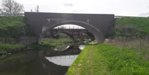 Three bridges - a new masonry clad bridge, with the original 18th century bridge and the new bridge seen through its span - on the River Ryton, in Nottinghamshire. Image: ABM Precast Solutions. 