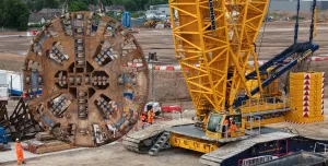 The 120-tonne, 8.62-metre diameter cutterhead of TBM Mary Ann being lifted from a 22-metre-deep portal at Washwood Heath using a 700-tonne crawler crane
