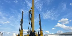 Three yellow piling rigs on a hard stand at RBL.