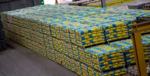 A pile of cement bags in a warehouse