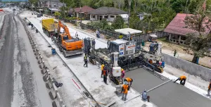 An aerial view of a road building project in Thailand showing Wirtgen’s SP 64 slipform paver installing reinforced concrete highways without the need for fixed formwork.