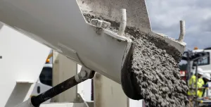 Concrete sliding off a delivery chute on a truck