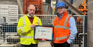 Chris Jones (right) of Mona Precast with David Wyke (left) of KVM, marking 25 years of block production at the Anglesey site.