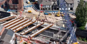 A blue crawler crane lifts Beam 9 into position at Greek Street last month (August, 2025).