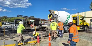 Men in PPE on a construction site where Boral has trialled the use of recarbonated recycled aggregates in its low-carbon Envisia concrete