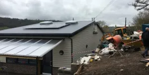 The incomplete concrete block retaining wall at Swainswick School collapsed after aggregate was placed against it.