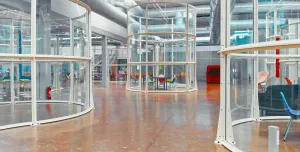 The glass canopy surrounding the outside escalators at the Centre Pompidou in Paris has been reused to create office space. (Image: Alexandre Attias)