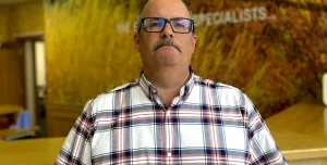 Kris Hand in checked shirt, glasses and a moustache, rejoins Roger Bullivant’s South Central residential team as operations manager, focusing on standardising practice, safety and skills development.