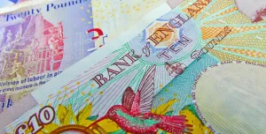 A close up of various UK paper money, including a £20 and £10 note.