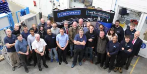 A group of workers in a factory photographed from above