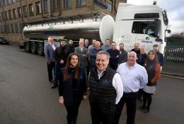 Oscrete Director Scott Wilson (front centre) is joined by the sales, lab and customer services teams at the company’s Bradford HQ to mark 40 years in business
