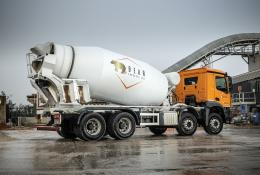A concrete mixer in a concrete production yard in the rain