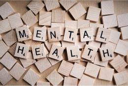 Wooden scrabble letter spelling Mental Health