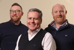 Three smiling men who all work for Oscrete.