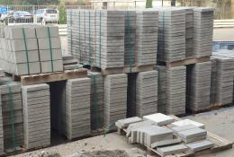 Concrete paving slabs stacked up in a builders yard